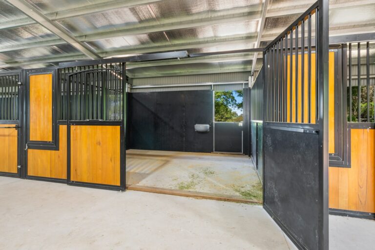 Horse stables with hardwood infill and powder coated frame in black