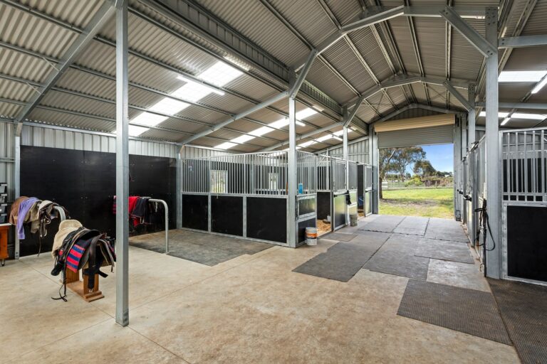Equibaord stables in American style barn