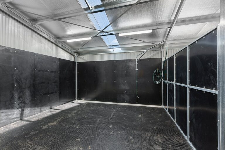 RSPCA equiboard lined wash bay with penny round rubber matting and wash bay boom