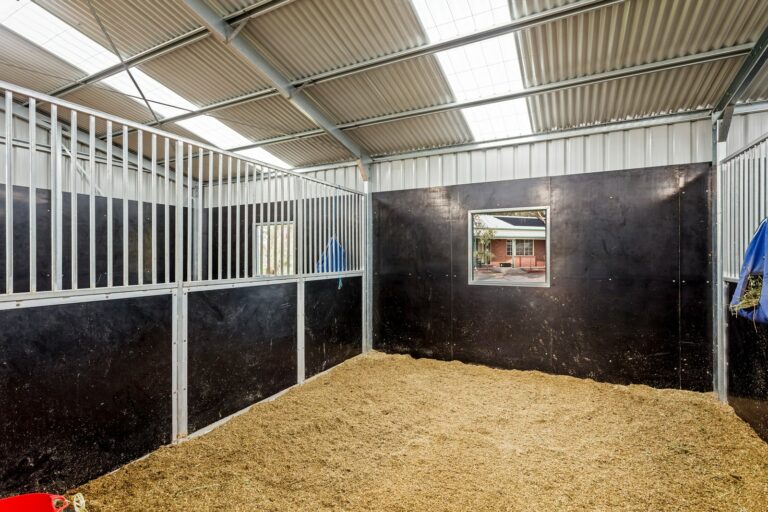 Equibaord stables in American style barn with shutter