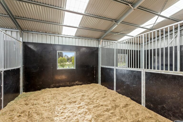 Equibaord stables in American style barn with shutter