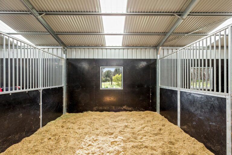Equibaord stables in American style barn with shutter