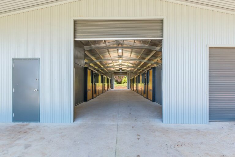 Horse stables with hardwood infill and powder coated frame in black