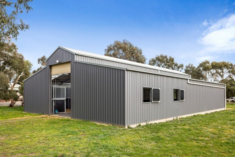 Equibaord stables in American style barn with stable shutters