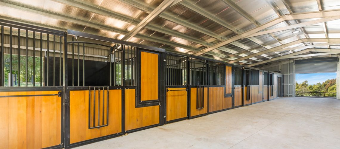 Horse stables with hardwood infill and powder coated frame in black